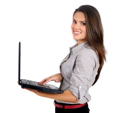 Isolated young business woman with laptopの写真素材