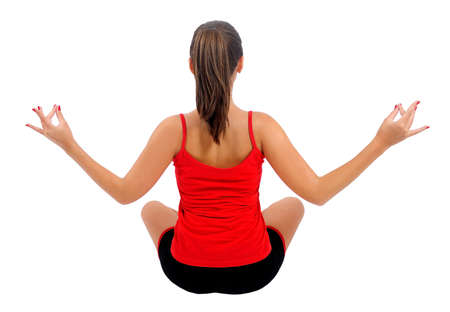 Isolated young fitness woman meditationの写真素材
