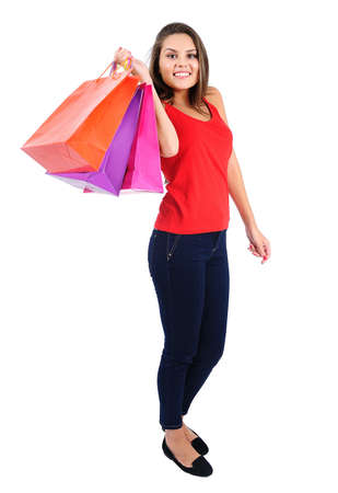 Isolated young casual girl with shopping bagの写真素材