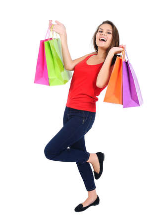 Isolated young casual girl with shopping bagの写真素材