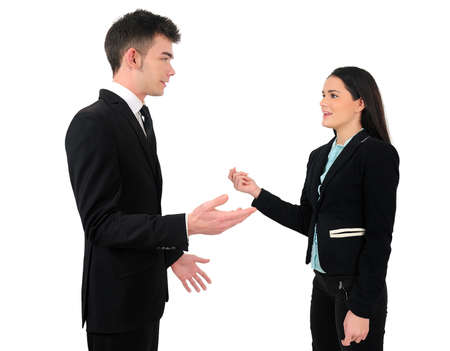Isolated young business couple talkingの写真素材