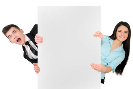 Isolated young business couple showingの写真素材