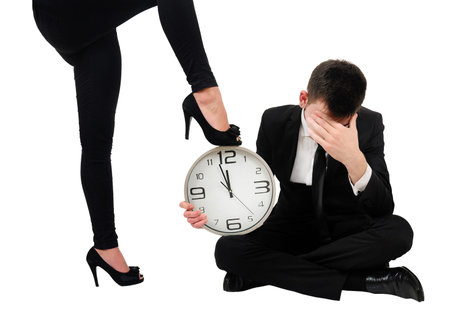 Isolated young business couple dominationの写真素材