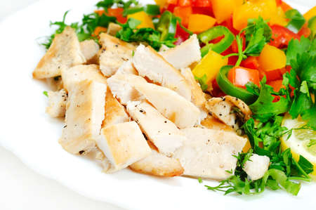 Plate with salad and chickenの写真素材
