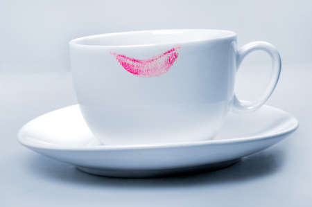 Lipstick pink on white  cup on blue background の写真素材