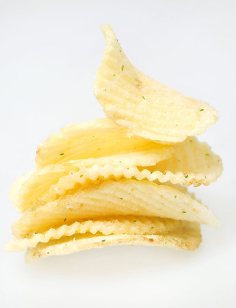 Chips  of potato  on grey background 