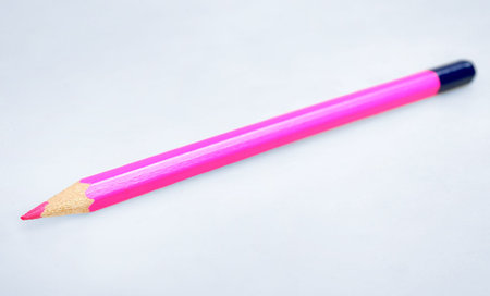 Pink pencil  on grey background の写真素材
