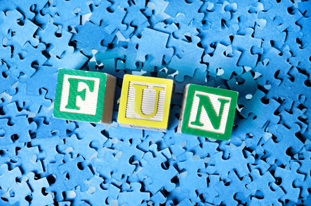 Fun word on a puzzle  background 