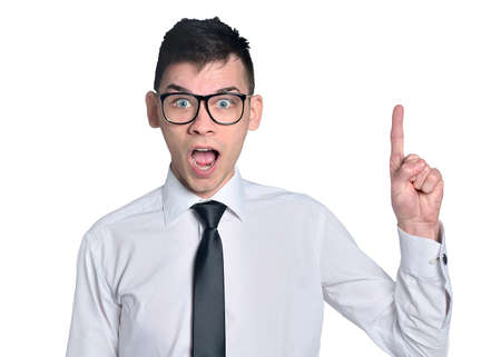 Business man amazed pointing upの写真素材