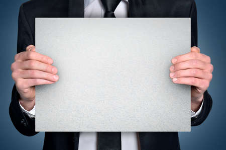 Business man with empty boardの写真素材