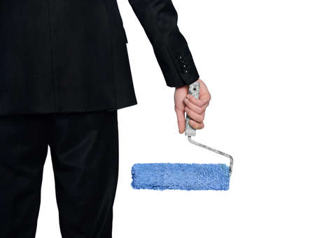 Isolated paint roller in man handの写真素材