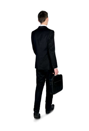 Isolated business man walking back viewの写真素材
