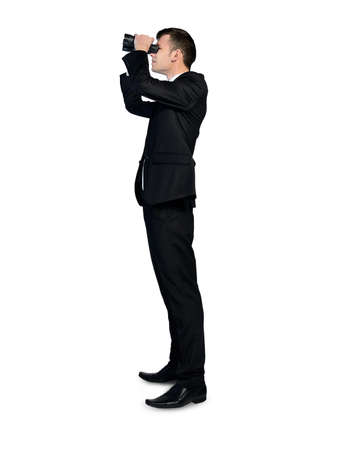 Isolated business man with binocularsの写真素材