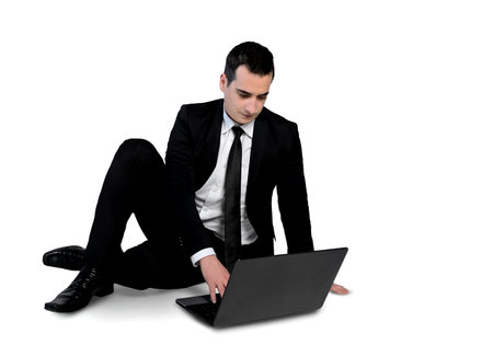 Isolated business man using computer