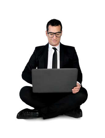 Isolated business man using computerの写真素材