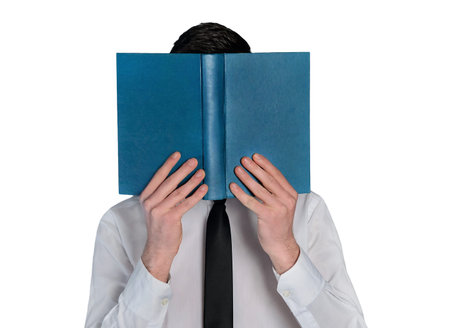 Isolated business man hide reading bookの写真素材
