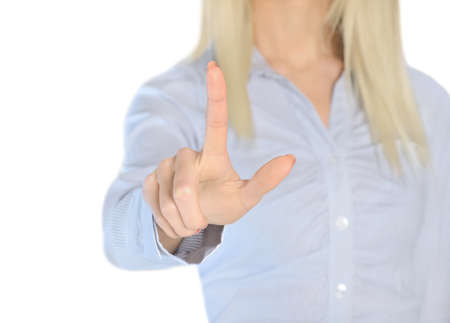 Isolated business woman pressing somethingの写真素材