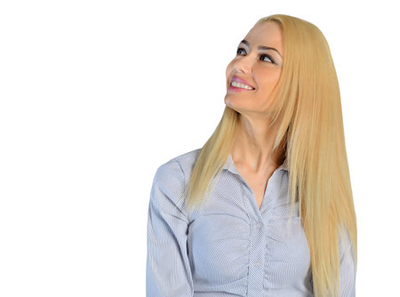 Isolated business woman looking upの写真素材