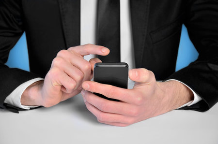Business man with phone at desk