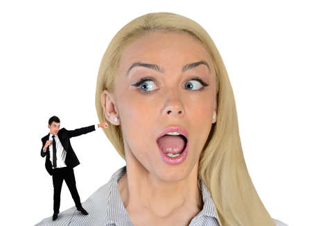 Isolated business woman looking surprised on little manの写真素材