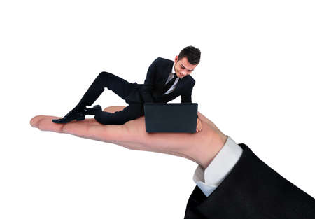 Isolated hand holding business man using computerの写真素材