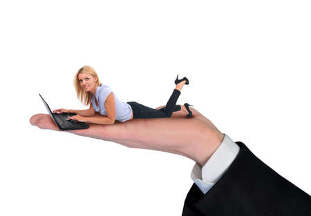 Isolated hand holding business woman using computerの写真素材