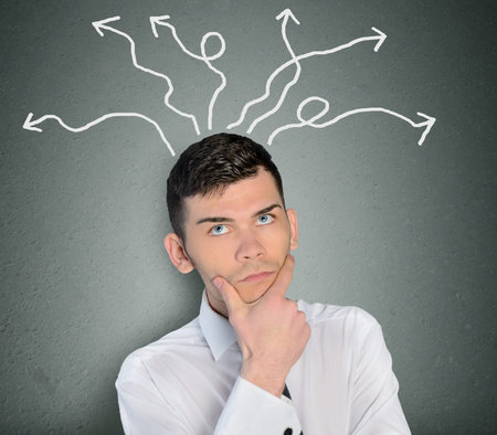 Young business man and many arrowsの写真素材