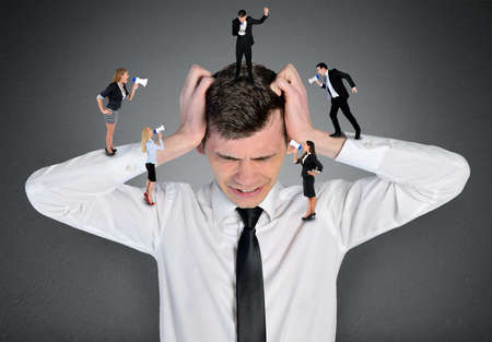 Young business man headache screamの写真素材