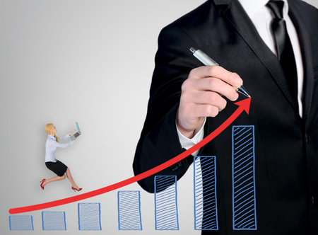 Business man close-up write success chartの写真素材