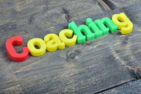 Coaching  word on wooden tableの写真素材