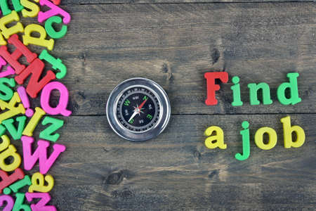 Find a job word on wooden table
