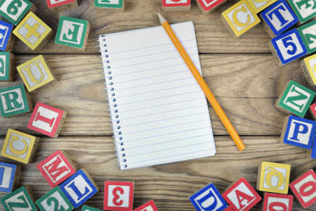 Notepad on wooden tableの写真素材
