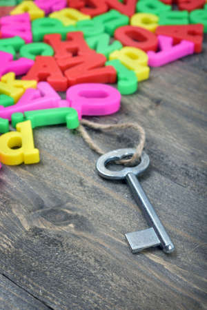 Old key word on wooden tableの写真素材