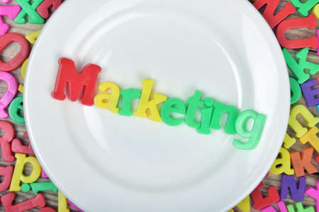 word on white plate and magnetic lettersの写真素材