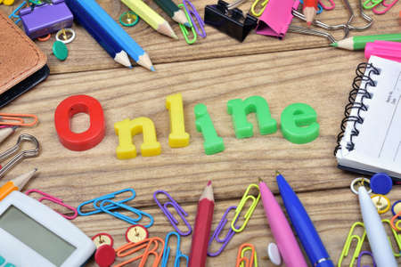 Online word and office tools on wooden table