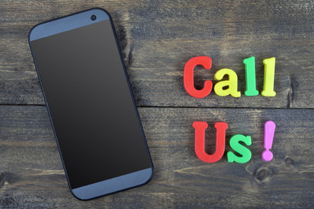 Call Us word on wooden table