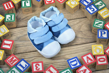 Kids shoes on wooden tableの写真素材