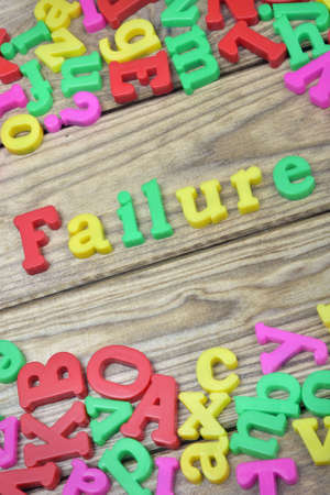Failure word on wooden tableの写真素材