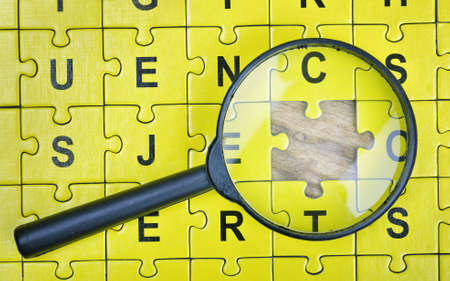 Puzzle pieces on wooden tableの写真素材