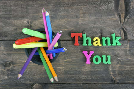 Thank you word on wooden tableの写真素材