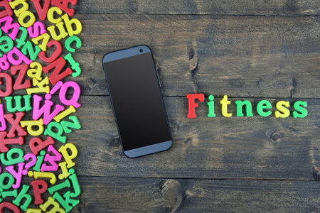 Fitness word on wooden tableの写真素材