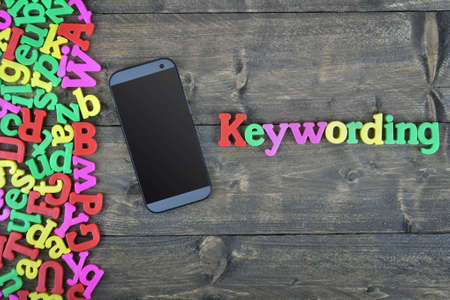 Keywording word on wooden tableの写真素材