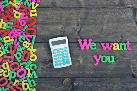 We want you word on wooden tableの写真素材