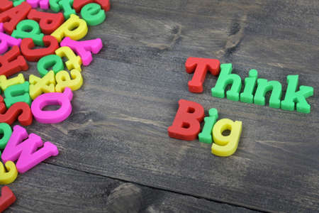 Think big word on wooden tableの写真素材