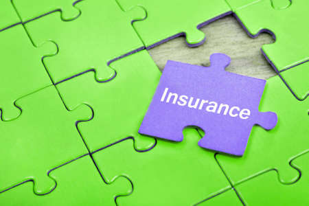Puzzle pieces with word Insuranceの写真素材