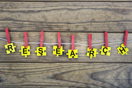Puzzle pieces with word Researchの写真素材