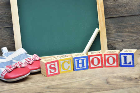 School board and word School on wooden table