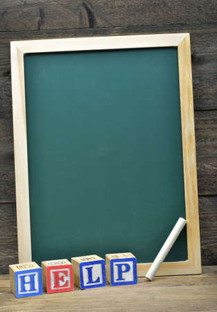 School board and word Help on wooden tableの写真素材
