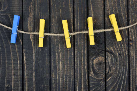 Five clips on wooden wallの写真素材