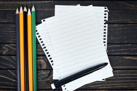 Empty paper and office tools on wooden table